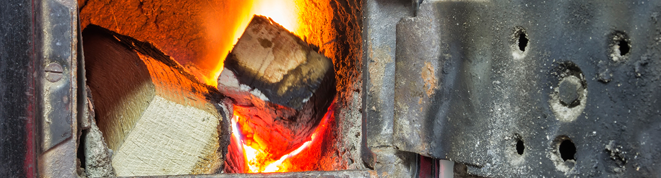 Interior solid fuel burning furnaces, boilers, and stoves